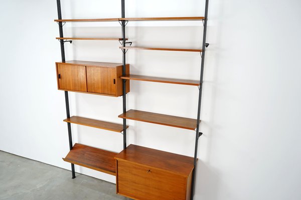 Scandinavian Shelving Unit With Reversible Sliding Doors From Pira