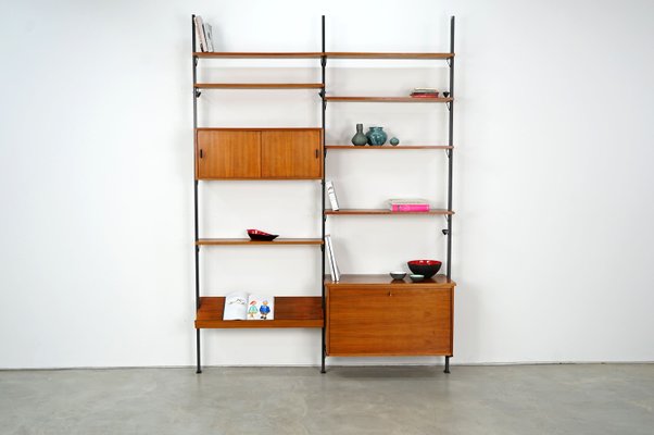 Scandinavian Shelving Unit With Reversible Sliding Doors From Pira