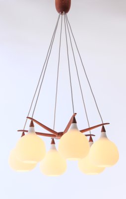 Scandinavian Modern Opaline Glass and Teak Spider Ceiling Lamp by Uno & Östen Kristiansson for Luxus, 1956 Scandinavian Modern Opaline Glass and Teak Spider Ceiling Lamp by Uno & Östen Kristiansson for Luxus, 1956