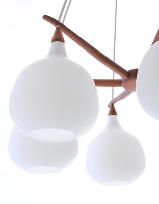 Scandinavian Modern Opaline Glass and Teak Spider Ceiling Lamp by Uno & Östen Kristiansson for Luxus, 1956 Scandinavian Modern Opaline Glass and Teak Spider Ceiling Lamp by Uno & Östen Kristiansson for Luxus, 1956