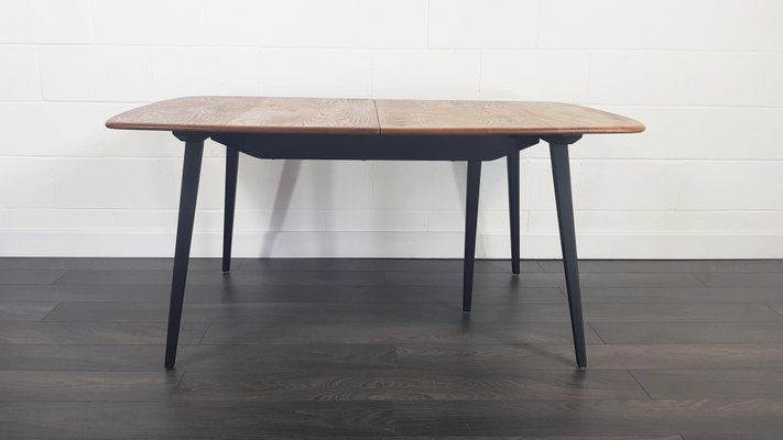 Mid Century Extendable Dining Table With Black Legs By Lucian Ercolani For Ercol 1960s Mid Century Extendable Dining Table With Black Legs By Lucian Ercolani For Ercol 1960s
