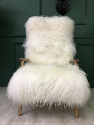 Fluffy white armchair top