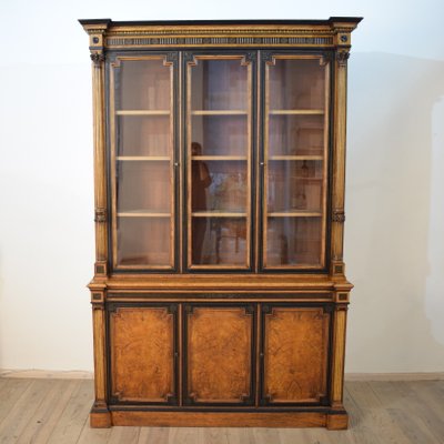Antique English Empire Style Elm Ebonized And Gilded Bookcase
