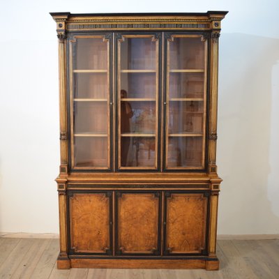 Antique English Empire Style Elm Ebonized And Gilded Bookcase