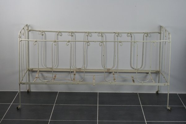 black wrought iron crib