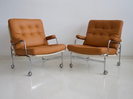 Brown Leather Model Karin Lounge Chairs by Bruno Mathsson for Dux, 1970s,  Set of 2 for sale at Pamono