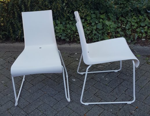 White plastic store stackable outdoor chairs