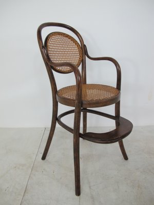 antique wooden high chair with wheels
