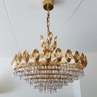 Hollywood regency gilt brass & crystal chandelier by Palwa, 1960s Hollywood regency gilt brass & crystal chandelier by Palwa, 1960s