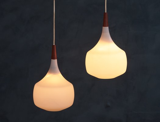 Mid Century Danish Opaline Glass and Teak Pendant Lamps from Holmegaard 1960s Set of 2