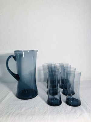 https://cdn20.pamono.com/p/g/7/1/715058_1napz90f5b/mid-century-scandinavian-blue-glass-juice-set-1960s-set-of-9-9.jpg