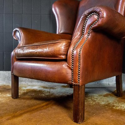 Vintage Cognac Brown Leather Wing Chair For Sale At Pamono