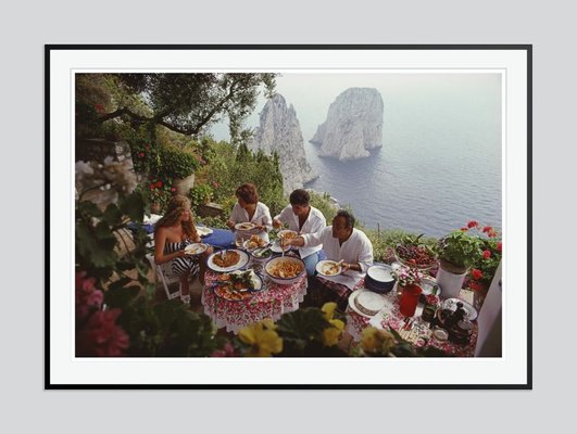 Dining Al Fresco On Capri C Print Framed in Black by Slim Aarons