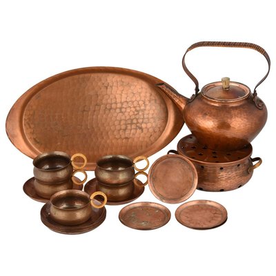 https://cdn20.pamono.com/p/g/7/5/751928_eyh9blvzri/vintage-copper-tea-set-by-eugen-mint-germany-1960s-set-of-20-1.jpg
