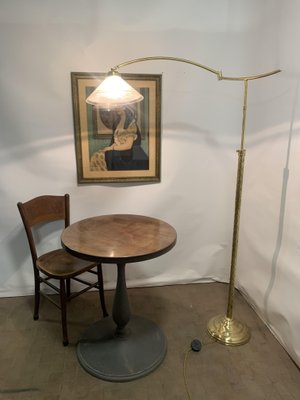 brass floor lamp with glass table