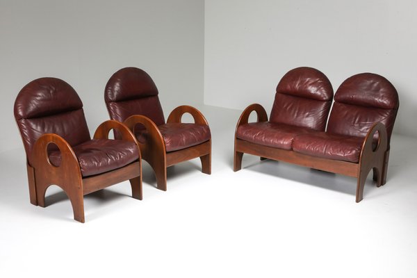 Arcata Burgundy Leather Walnut Lounge Chairs by Gae Aulenti for