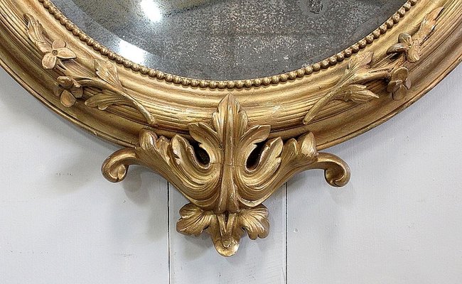Grand miroir ovale Napoléon III doré