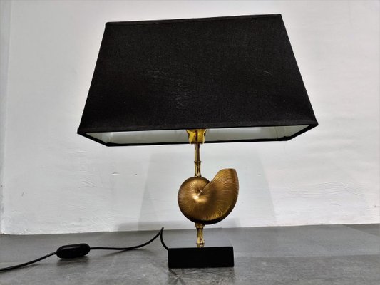 https://cdn20.pamono.com/p/g/8/0/806499_dx86wcte1d/vintage-brass-nautilus-shell-table-lamp-1970s-2.jpg