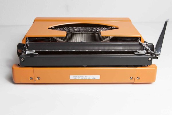 Máquina de Escribir Silver Reed Naranja – La Vieja