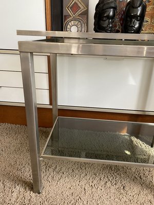 Brushed metallic console table on sale with display shelves
