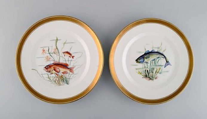 Platos de pescado de porcelana con peces pintados a mano de Royal Copenhagen. Juego de 10 en venta en Pamono