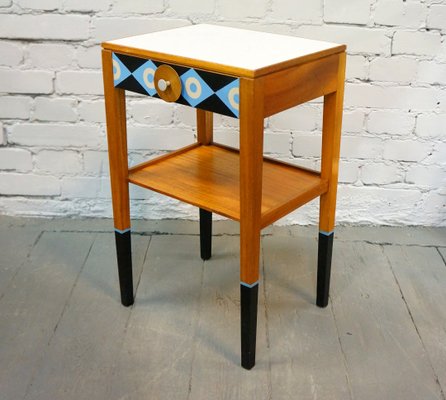 Vintage end on sale table with bookshelf