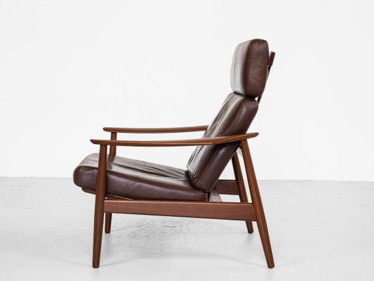 Teak and leather store lounge chair
