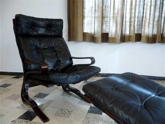 Scandinavian leather recliner hotsell with ottoman
