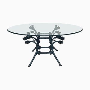 Mesa de centro italiana neoclásica ornamental de hierro forjado con superficie de vidrio ovalada