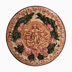 Piatto in terracotta con cherubini e fiori, Spagna, XIX secolo