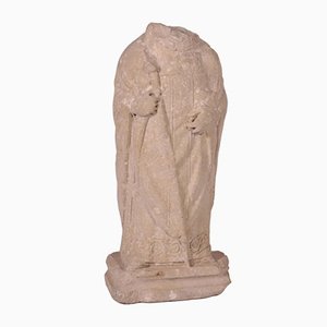 Obispo sin cabeza, estatua de piedra
