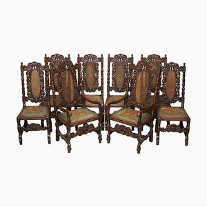 Sillas de comedor trono jacobeas talladas con asientos de cuero grabados y pintados a mano. Juego de 8
