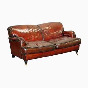 Sofá de cuero marrón rojizo