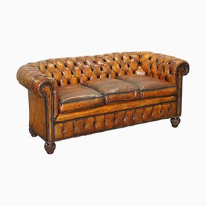 Divano Chesterfield in pelle marrone, inizio XX secolo