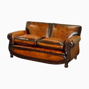Sofá de dos plazas de cuero marrón