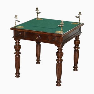 Mesa de juegos victoriana con botones y cajones secretos, década de 1840