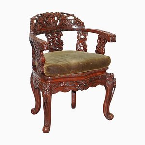 Vintage Chinese Red Lacquered Carved Elm Armchair with Heavy Foliage Detailing