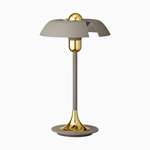 Lámpara de mesa en gris y dorado