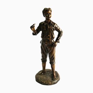 Figura de niño francesa de bronce, siglo XX