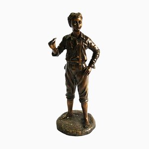 Figura de niño francesa de bronce, siglo XX