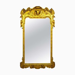 Espejo de pared francés de madera tallada y dorada con querubín y acanto