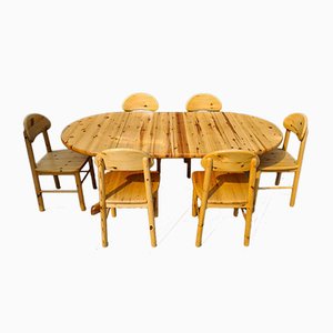 Juego de comedor extensible de madera de pino con 6 sillas. Juego de 7