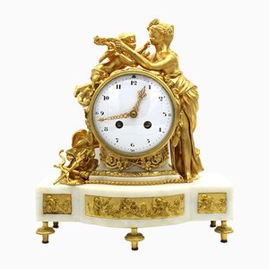 Reloj de péndulo Napoleón III de bronce dorado y mármol, siglo XIX