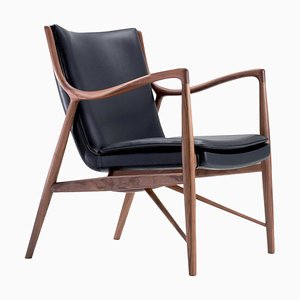45 Stuhl aus Holz und schwarzem Leder von Finn Juhl