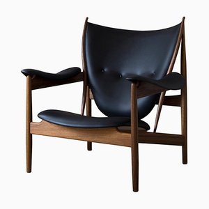 Chieftain Armchair in Wood and Black Leather by Finn Juhl