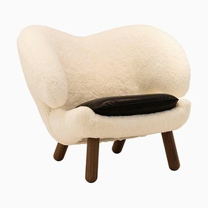 Pelican Chair in Skandilock Sheep and Black Leather by Finn Juhl