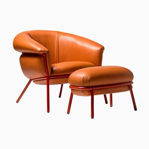 Stephen Burks Grasso Orange Leather Armchair and Foot Stool