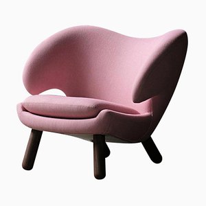 Pelican Stuhl mit pinkem Stoffbezug von Finn Juhl
