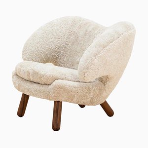 Pelican Chair in Moonlight Skandilock Sheep Wool and Wood by Finn Juhl