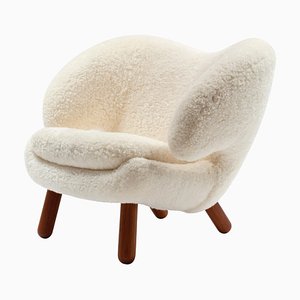 Skandilock Sheep Off-White and Wood Pelican Armchair by Finn Juhl